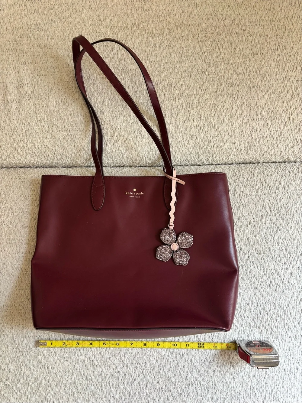 kate spade Burgundy Leather Tote with Floral Charm